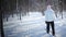 Woman Cross-Country Skiing Alone in Nature