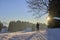 Woman cross-country skiing short before sunset in the Bregenz Forest Mountains