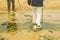 A Woman Crossing a Creek in Scotland, Uk