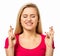 Woman Crossing Fingers Over White Background