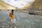 A woman crossing the Markha River, Ladakh, India