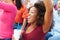 Woman In Crowd Celebrating At Sports Event