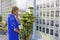 Woman crying in front of the Wall of Remembrance put flowers. Meeting devoted to the anniversary of the battle of