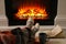 Woman with cup of hot drink and book resting near fireplace at home, closeup