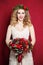 Woman with Curly Blond Hair. Bride with Flowers