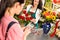 Woman customer paying flowers shop credit card
