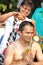 Woman cut hair of man for be Ordained to new monk