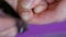 Woman cuts long overgrown toenails with steel clippers. Manicuring finger nails. Health and beauty concept. Finger tip