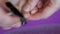 Woman cuts long overgrown toenails with steel clippers. Manicuring finger nails. Health and beauty concept. Finger tip