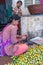 Woman cuts out betel nut, Kadenahalli, Karnataka, India