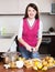 Woman cuts pears for pear jam