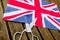 A woman cuts with scissors the British flag in protest