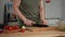 A woman cuts sweet peppers on a kitchen board. Home Cooking,