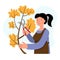 Woman cuts trees in the garden. Autumn work in the garden. Gardening.