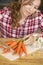 Woman cutting carrots