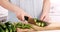 Woman cutting courgette