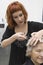 Woman Cutting Female Client\'s Hair In Salon