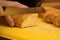 Woman cutting french loaf