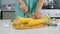 Woman cutting fresh corn on wooden board cooking vegetable dish at home.