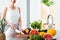 Woman cutting fruit in kitchen