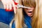 Woman cutting her fringe.