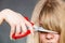 Woman cutting her fringe.