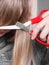 Woman cutting her fringe.