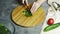 Woman cutting leek with knife on a wooden board. slow motion