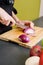 Woman Cutting an Onion