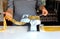 Woman cutting pasta dough on the machine at home