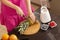 Woman cutting pineapple with a kitchen knife