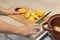 woman cutting potatoes on a kitchen board