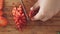 Woman cutting strawberry