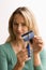 Woman Cutting Up Credit Card