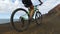 Woman cycling on mountain bike mtb in nature - girl exercising in summer