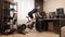 Woman is cycling on smart bicycle trainer. Indoor cycling. Female cyclist is doing fitness workout on exercise bike. Athlete is pe