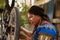 Woman cyclist repairing bicycle