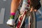 Woman cyclist`s hand checking the bike wheel tire pressure.