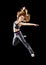 Woman dancer dancing modern dance, jump on a black