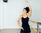 Woman in dancewear practicing hand moves