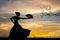 Woman dancing flamenco at sunset