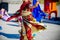 Woman dancing oriental dances in it is red gold dresses