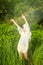 Woman dancing in summer rain