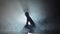 woman in dark studio booty dance in silhouette. Slow
