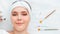 Woman during darsonval cosmetology procedure for skin care lies with beauty injection syringe facial mask brushes