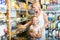 Woman with daughter buying pasta in store