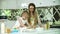 Woman With Daughter Cooking, Baking Together At Kitchen