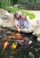 Woman and daughter feeding fishes.