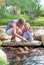 Woman and daughter feeding fishes.