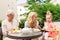 Woman with daughter and senior mother at cafe